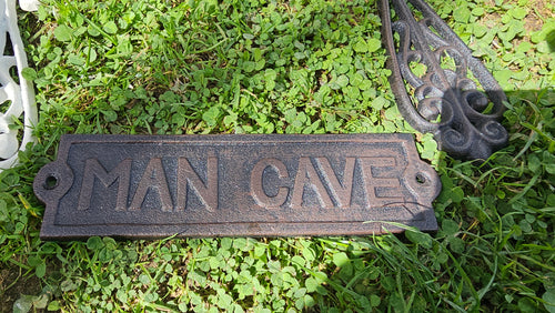 CAST IRON MAN CAVE SIGN